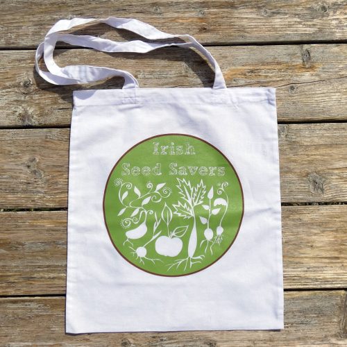 ISSA tote bag lying flat on wooden table